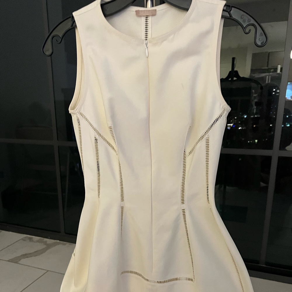 Light Crème Alaia summer dress with extraordinary detail.
